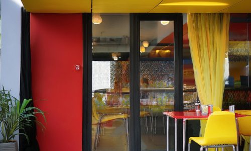 Firefly a fast food restaurant out side view photo color yellow black and red clean and minimal exte (3)